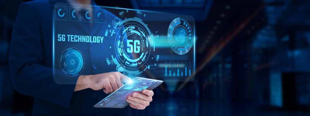 Person standing behind virtual display with 5G Technology on it