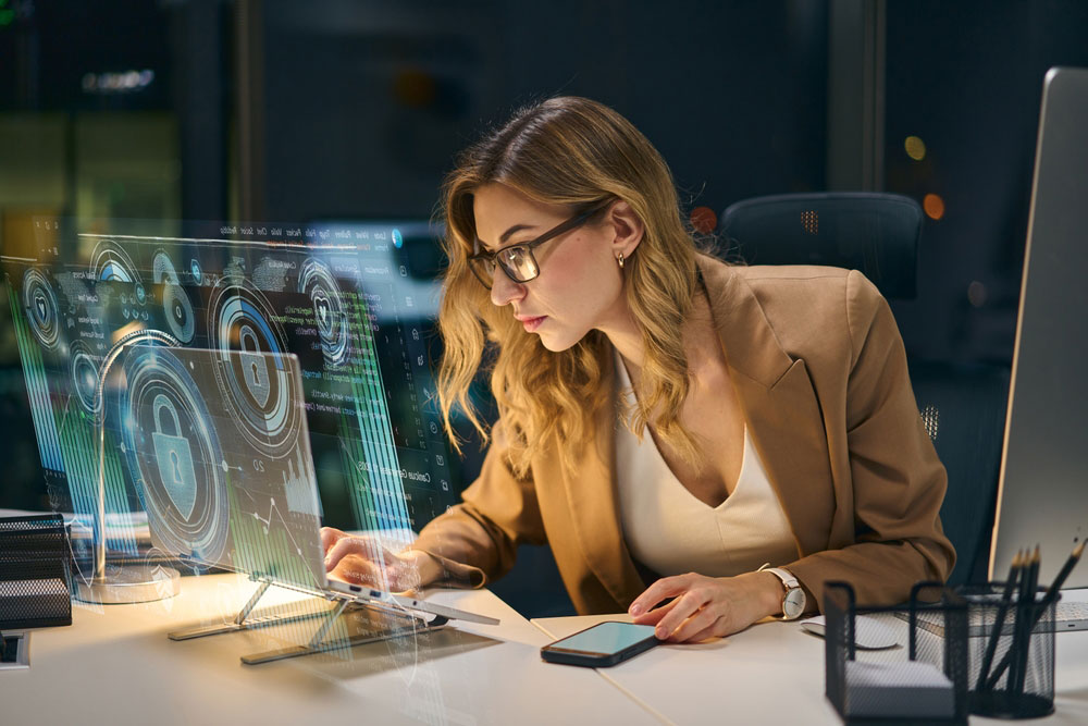 Cybersecurity expert reviewing a network on a virtual display