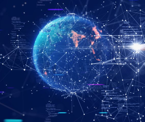 Hand touching polygons on a virtual display with a globe in the center