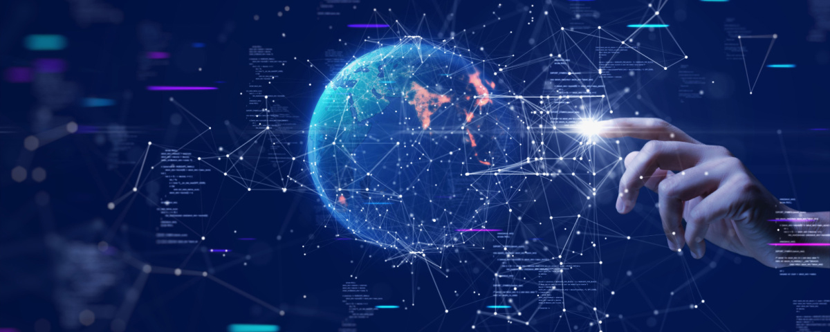 Hand touching polygons on a virtual display with a globe in the center