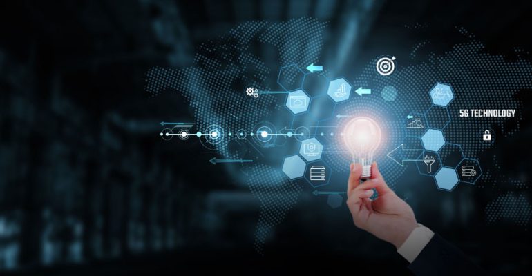 Hand holding light bub surrounded by iOT icons