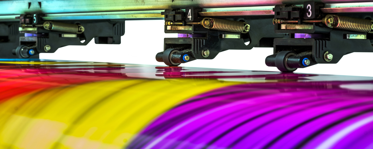 Close up of wide format printer producing colorful output