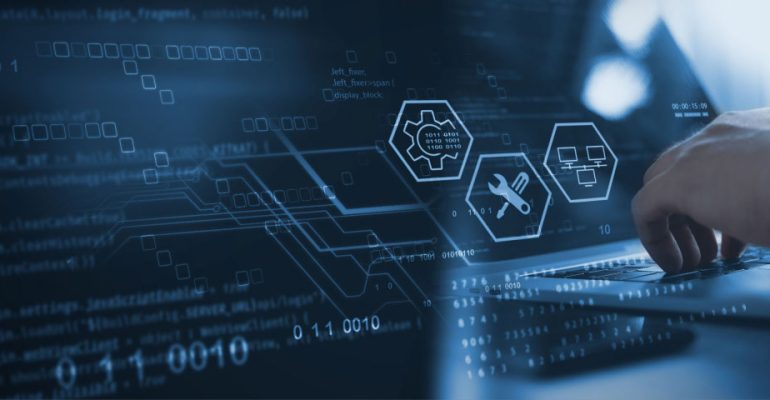 Programmer coding on laptop with IT icons floating above his hands
