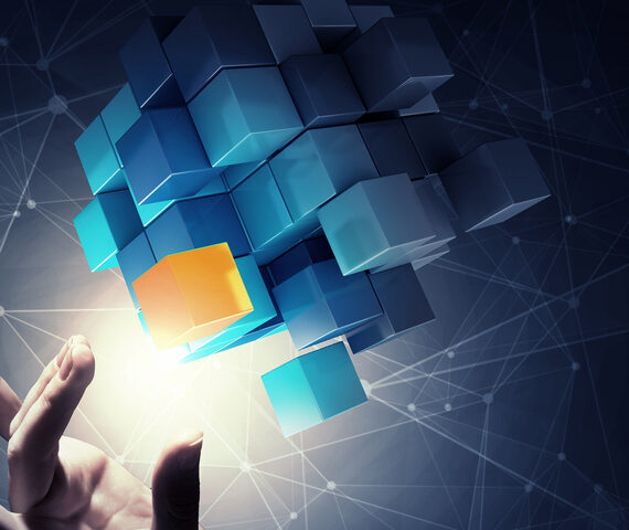 Hand reaching to pull a yellow block from a group of blue blocks floating in the air