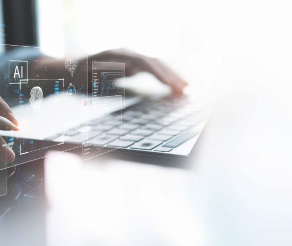Hands typing on a computer keyboard with a virtual display floating above
