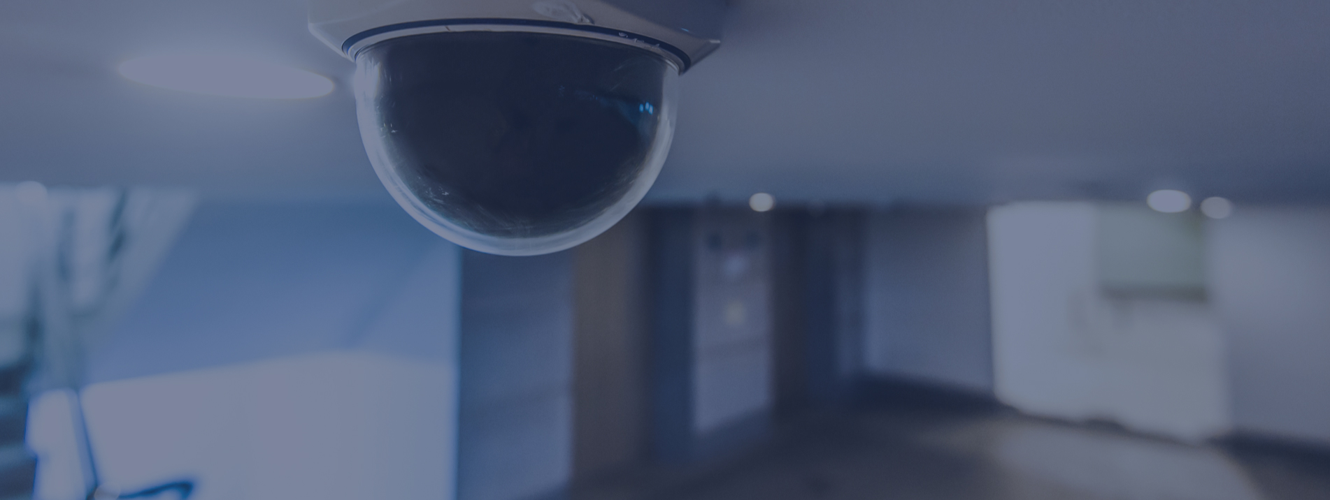 Close up of video security camera in building hallway be elevators